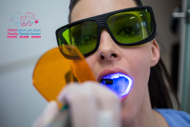 A woman is using Laser Dentistry to treat her teeth