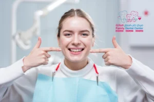 A girl smiling, showing her beautiful teeth after orthodontic treatment